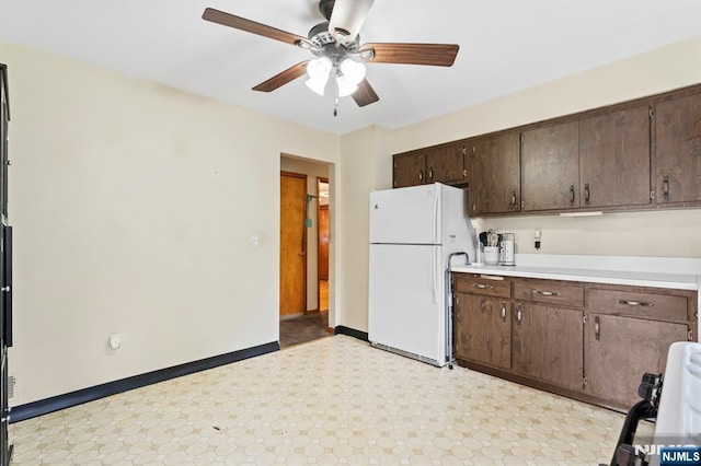 132 17th St, Prospect Park, NJ 07508 - kitchen with freestanding refrigerator, stove, light floors, ceiling fan, and dark brown cabinetry