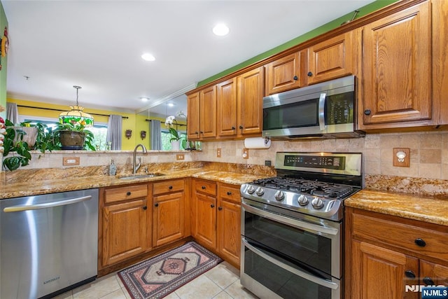 143 Summit Rdg, Pompton Lakes, NJ 07442 - kitchen featuring appliances with stainless steel finishes, brown cabinets, and recessed lighting