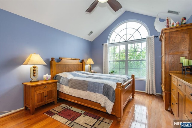 143 Summit Rdg, Pompton Lakes, NJ 07442 - bedroom featuring multiple windows, vaulted ceiling, light wood-type flooring, and ceiling fan
