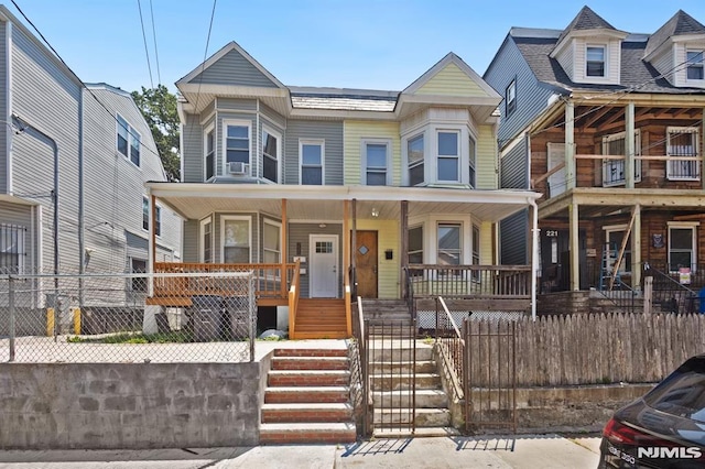 223 N 6th St, Newark, NJ 07107 - townhome / multi-family property featuring a porch