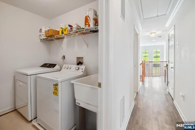 66 Spruce Ln, North Haledon, NJ 07508 - laundry room featuring attic access, separate washer and dryer, and light wood finished floors