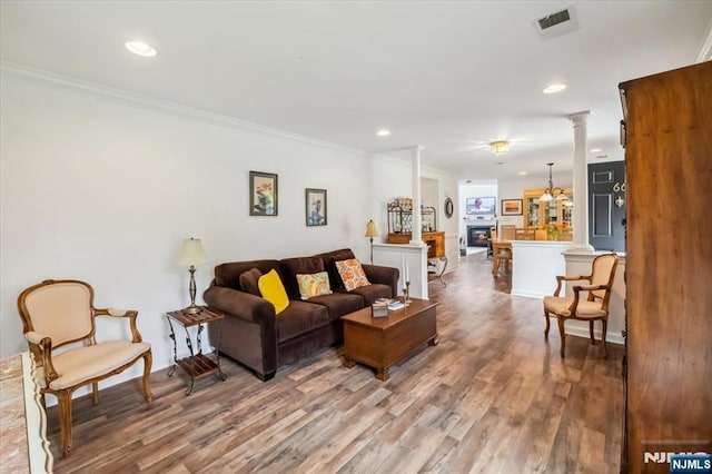 66 Spruce Ln, North Haledon, NJ 07508 - living room featuring decorative columns, wood finished floors, ornamental molding, and recessed lighting