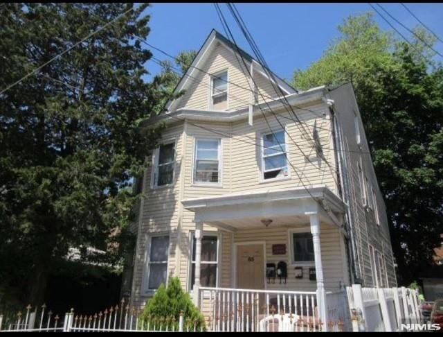 65 N 8th, Paterson, NJ 07522 - american foursquare style home featuring a porch