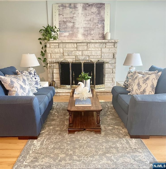 76 Central Ln, Secaucus, NJ 07094 - living area featuring wood finished floors and a fireplace with raised hearth