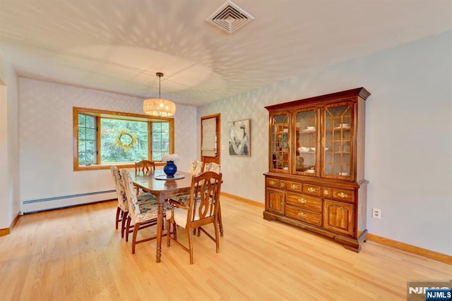 76 Central Ln, Secaucus, NJ 07094 - dining area featuring a baseboard radiator, light wood finished floors, wallpapered walls, and a chandelier