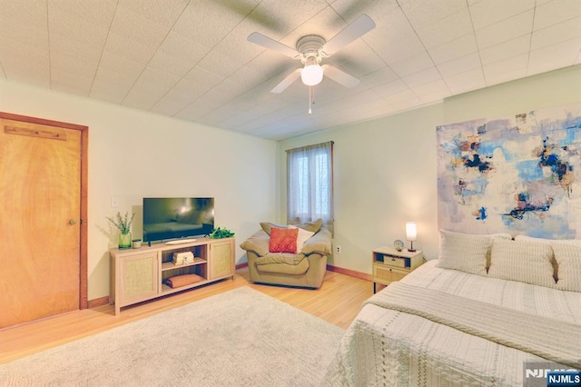 76 Central Ln, Secaucus, NJ 07094 - bedroom with light wood-style floors and a ceiling fan