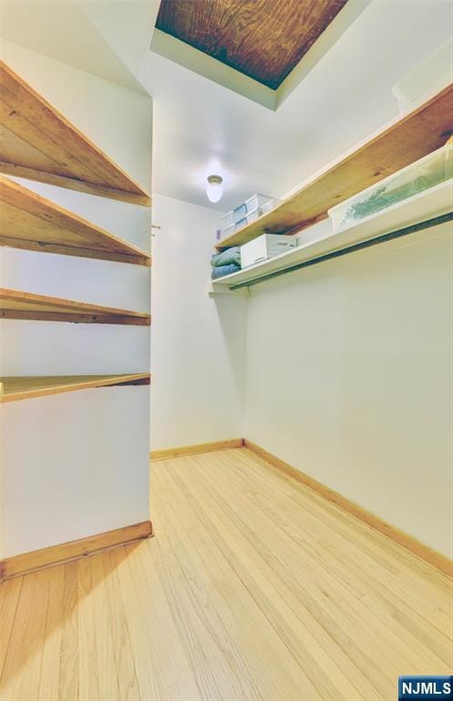 76 Central Ln, Secaucus, NJ 07094 - walk in closet featuring wood finished floors