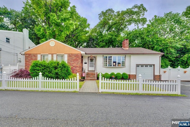 76 Central Ln, Secaucus, NJ 07094 - ranch-style house with a garage, brick siding, a chimney, and a fenced front yard