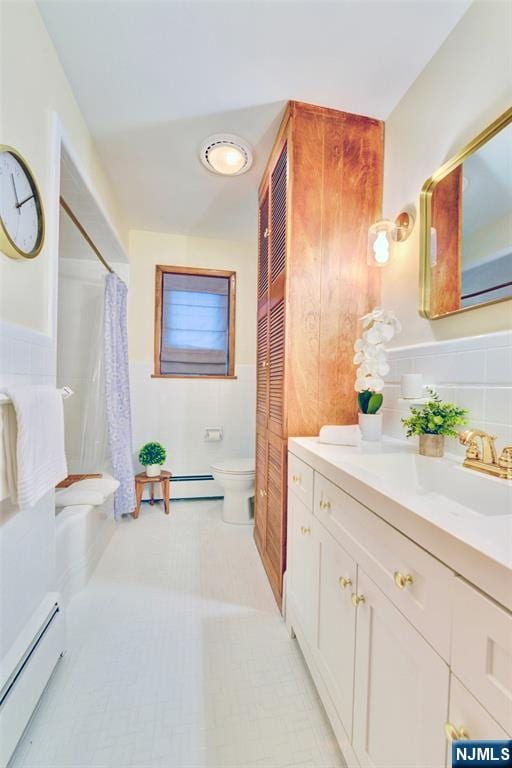 76 Central Ln, Secaucus, NJ 07094 - full bath featuring a baseboard radiator, vanity, a shower with shower curtain, and a wainscoted wall