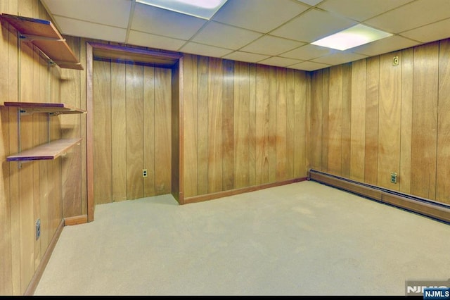 76 Central Ln, Secaucus, NJ 07094 - carpeted empty room featuring wooden walls and a paneled ceiling
