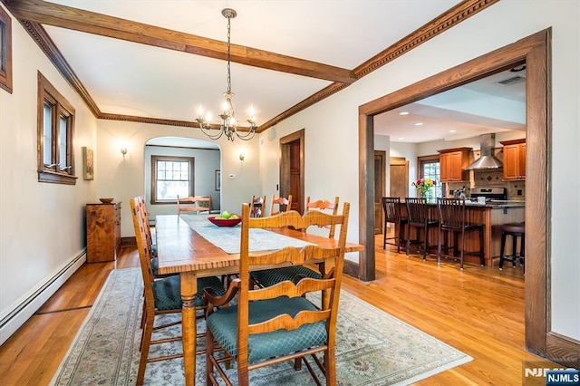 34 Harding Rd, Glen Rock, NJ 07452 - dining room with a baseboard radiator, light wood finished floors, plenty of natural light, a chandelier, and crown molding
