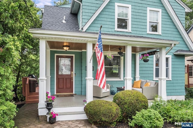34 Harding Rd, Glen Rock, NJ 07452 - entrance to property with a porch, a shingled roof, and a ceiling fan