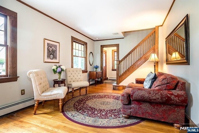 34 Harding Rd, Glen Rock, NJ 07452 - living area featuring a baseboard radiator, crown molding, wood finished floors, and stairs