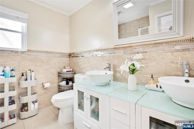 695 Midland Ave, Garfield, NJ 07026 - full bathroom featuring double vanity, crown molding, tile walls, a tile shower, and tile patterned flooring