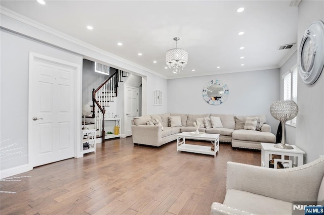 695 Midland Ave, Garfield, NJ 07026 - living area with stairs, a chandelier, wood finished floors, ornamental molding, and recessed lighting