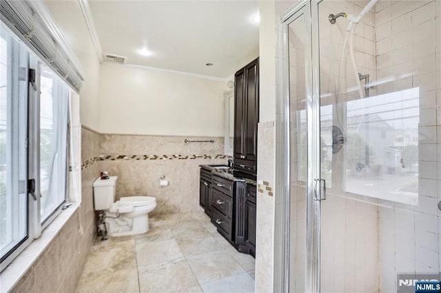 695 Midland Ave, Garfield, NJ 07026 - full bath featuring ornamental molding, a stall shower, vanity, and tile walls