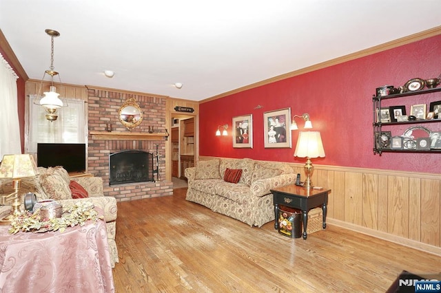 279 Rock Ave, Park Ridge, NJ 07656 - living area with wood finished floors, a wainscoted wall, a fireplace, crown molding, and wood walls