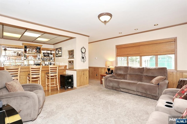 279 Rock Ave, Park Ridge, NJ 07656 - carpeted living area with a wainscoted wall, a dry bar, crown molding, and wooden walls