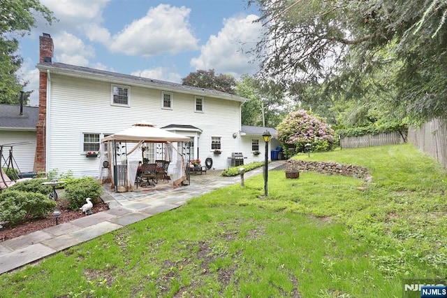 279 Rock Ave, Park Ridge, NJ 07656 - back of house with a gazebo, a patio area, and a chimney