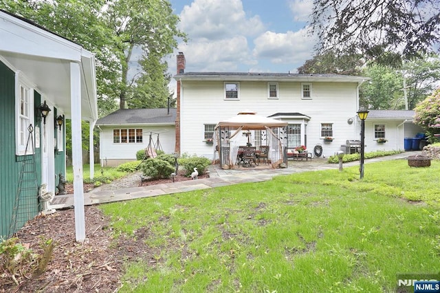 279 Rock Ave, Park Ridge, NJ 07656 - back of property featuring a gazebo, a chimney, a yard, and a patio