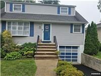 100 Grove St, Waldwick, NJ 07463 - view of front facade with a garage