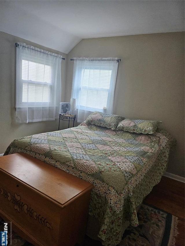 100 Grove St, Waldwick, NJ 07463 - bedroom with lofted ceiling and wood finished floors