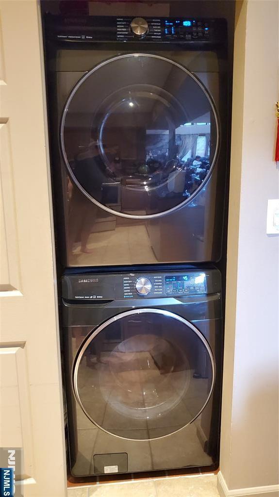705 Mainsail Ln, Secaucus, NJ 07094 - washroom with stacked washer and clothes dryer
