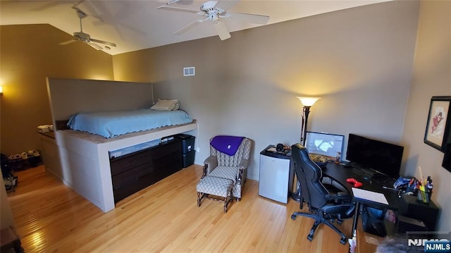 705 Mainsail Ln, Secaucus, NJ 07094 - bedroom with wood finished floors, an office area, lofted ceiling, and ceiling fan