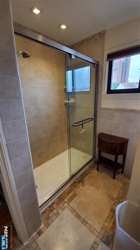 705 Mainsail Ln, Secaucus, NJ 07094 - full bath with a shower stall, recessed lighting, and tile walls