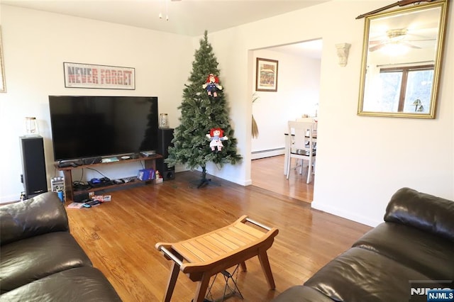 116 Scott Rd, Franklin, NJ 07416 - living room with a baseboard heating unit, a ceiling fan, and wood finished floors