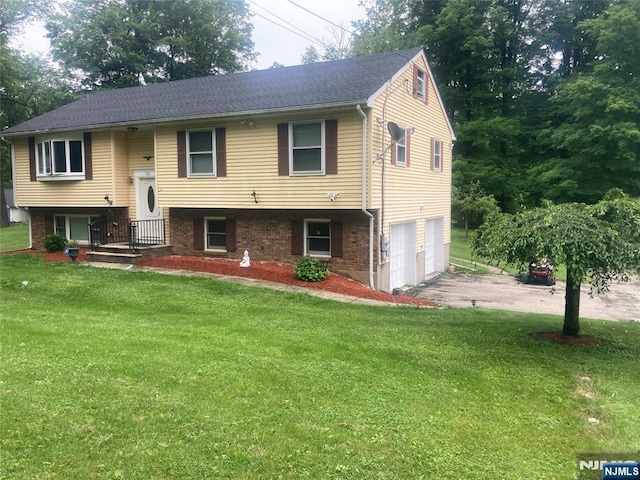 116 Scott Rd, Franklin, NJ 07416 - raised ranch featuring driveway, an attached garage, a front lawn, and brick siding