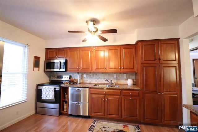 116 Scott Rd, Franklin, NJ 07416 - kitchen featuring stainless steel appliances, ceiling fan, stone counters, and light wood finished floors