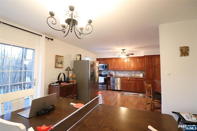 116 Scott Rd, Franklin, NJ 07416 - dining room with a chandelier, light wood-style flooring, and a ceiling fan