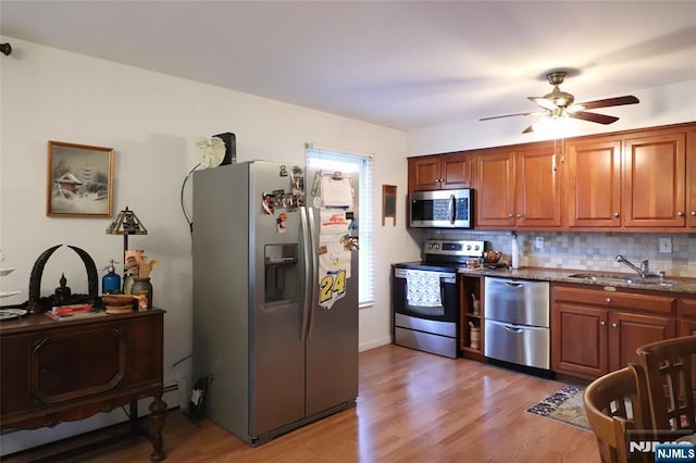 116 Scott Rd, Franklin, NJ 07416 - kitchen with appliances with stainless steel finishes, ceiling fan, backsplash, light wood-type flooring, and brown cabinetry