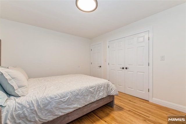 63 E Midland Ave, Kearny, NJ 07032 - bedroom featuring light wood finished floors and a closet