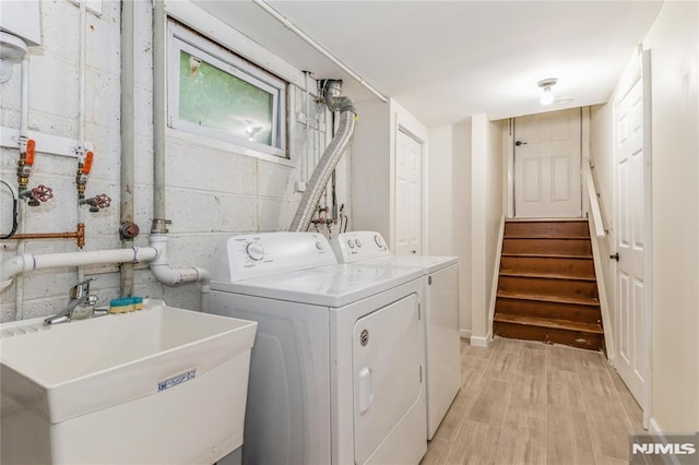 63 E Midland Ave, Kearny, NJ 07032 - laundry room featuring washing machine and clothes dryer and light wood-style flooring