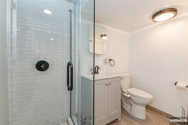 63 E Midland Ave, Kearny, NJ 07032 - full bathroom featuring a shower stall, wood finished floors, and vanity