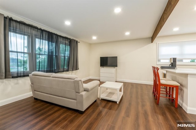 63 E Midland Ave, Kearny, NJ 07032 - living area with dark wood finished floors, recessed lighting, and beam ceiling