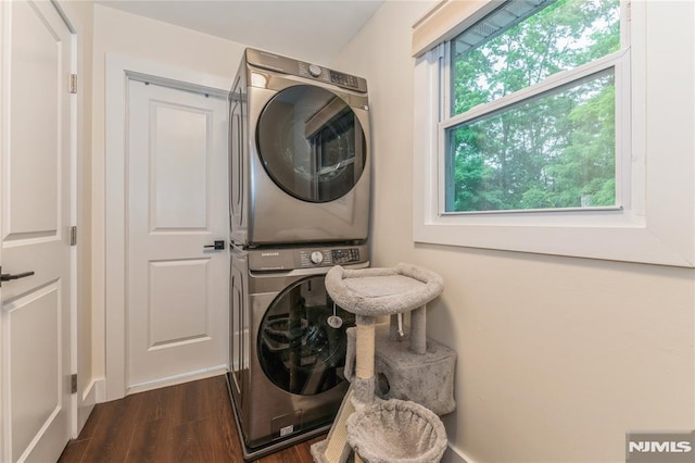63 E Midland Ave, Kearny, NJ 07032 - laundry room featuring stacked washer / drying machine and dark wood-type flooring