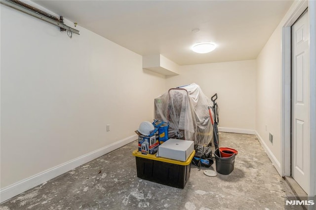 63 E Midland Ave, Kearny, NJ 07032 - recreation room with unfinished concrete flooring and baseboards