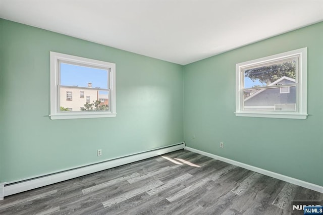17 Cuozzo St Unit 27, Belleville, NJ 07109 - spare room featuring baseboard heating and wood finished floors