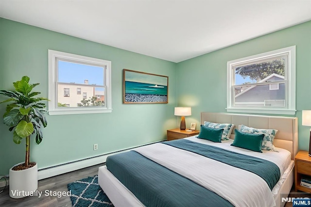 17 Cuozzo St Unit 27, Belleville, NJ 07109 - bedroom with wood finished floors and a baseboard radiator