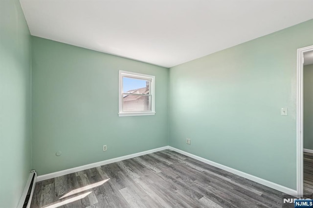17 Cuozzo St Unit 27, Belleville, NJ 07109 - empty room with baseboard heating and wood finished floors