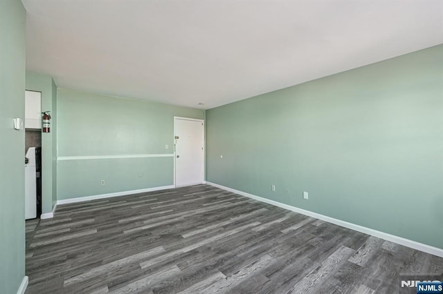 17 Cuozzo St Unit 27, Belleville, NJ 07109 - empty room featuring dark wood-type flooring and washer / clothes dryer