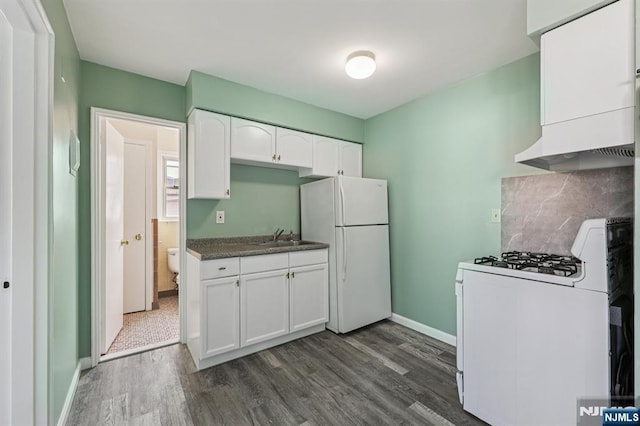 17 Cuozzo St Unit 27, Belleville, NJ 07109 - kitchen featuring white appliances, dark wood-type flooring, white cabinets, decorative backsplash, and dark countertops