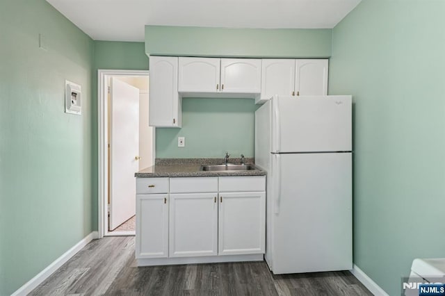 17 Cuozzo St Unit 27, Belleville, NJ 07109 - kitchen featuring freestanding refrigerator, dark wood-style floors, white cabinets, and dark countertops