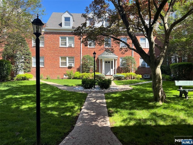 735 Elm Ave Unit 2C, Teaneck, NJ 07666 - view of front of home featuring a front lawn and brick siding