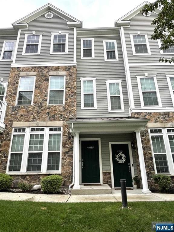 23 Dahlia Ln Unit 23, Garfield, NJ 07026 - multi unit property featuring stone siding and a front lawn