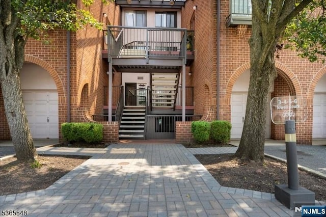 4 Lowell Ct Unit 704, Teaneck, NJ 07666 - property entrance with a balcony and brick siding