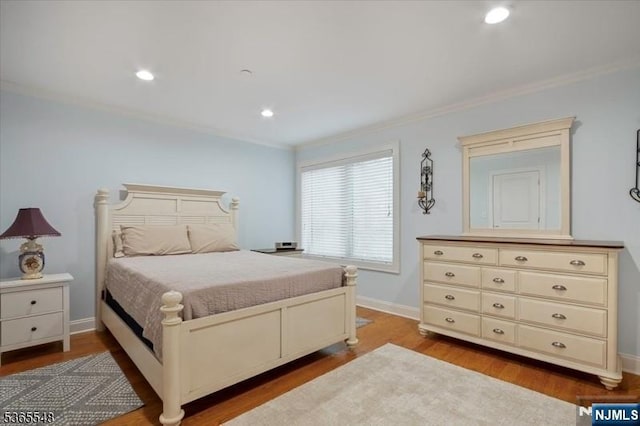 4 Lowell Ct Unit 704, Teaneck, NJ 07666 - bedroom featuring wood finished floors, ornamental molding, and recessed lighting